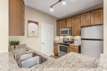Kitchen with granite countertops and double sink
