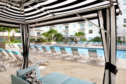 Poolside cabanas at Camden Brickell apartments in Miami, FL