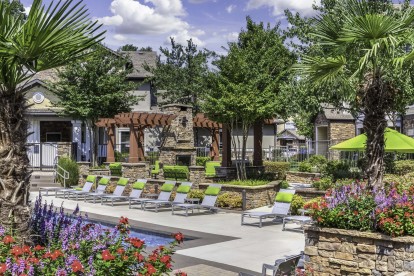 Relax on our beautiful pool deck with lounge chairs at Camden Asbury Village in Raleigh, NC. 