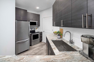 Kitchen with stainless steel appliances at Camden Monument Place apartments in Fairfax, VA