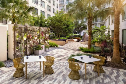 Zen garden with comfortable seating and hanging plants