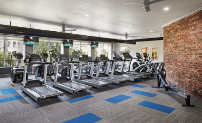 Fitness center cardio equipment at Camden Farmers Market Apartments in Dallas, TX