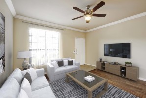 Living room with crown molding wood style flooring and ceiling fan