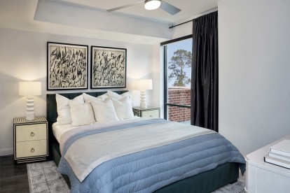 Modern gray bedroom with ceiling fan