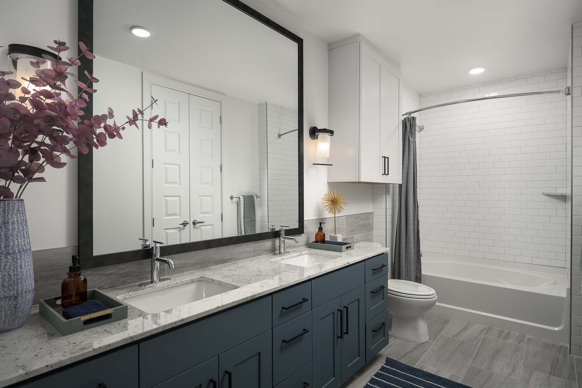 Bathroom with slate cabinets and bathtub at Camden Gilbert apartment homes in Gilbert, AZ