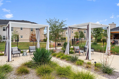 Poolside cabanas with seating at Camden Leander apartments in Leander, Tx