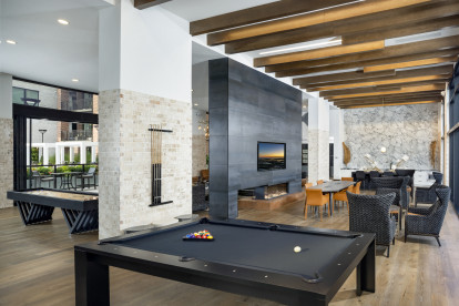 Resident lounge with billiards shuffleboard televisions and seating