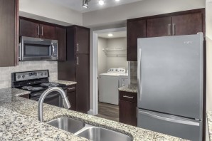 Kitchen with granite countertops and espresso cabinets