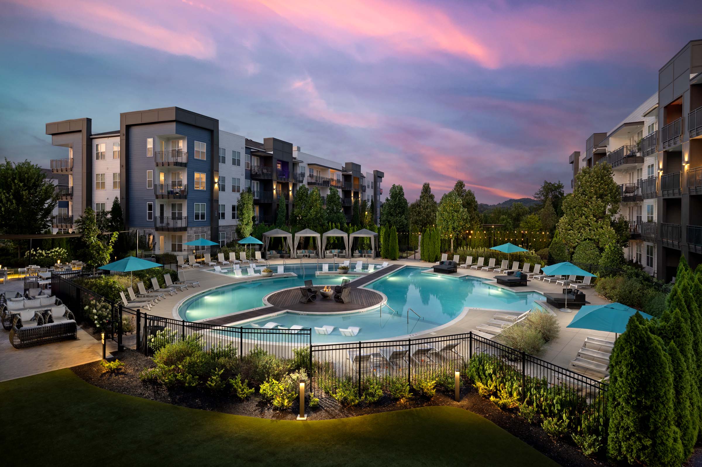 Resort-style pool at twilight at Camden West Nashville apartments in Nashville, TN