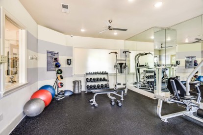 Fitness center with free weights at Camden Governors Village