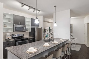 Kitchen with island seating at Camden Fairfax Corner in Fairfax, Virginia