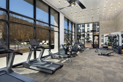 Fitness Center with TRX Trainer and Cardio Equipment