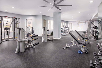 Fitness center with strength equipment and free weights at Camden Lakeway apartment in Lakewood, CO