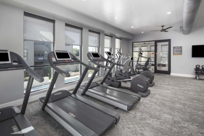 24-hour fitness center with cardio machines at Camden Greenville apartments in Dallas, TX