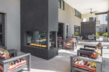 Camden Tempe West Apartments in Tempe Arizona outdoor resident lounge with fire pit and ample seating options 