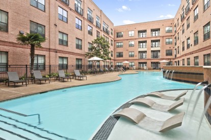 Resort-style pool with sun loungers at Camden Plaza Apartments in Houston, TX 