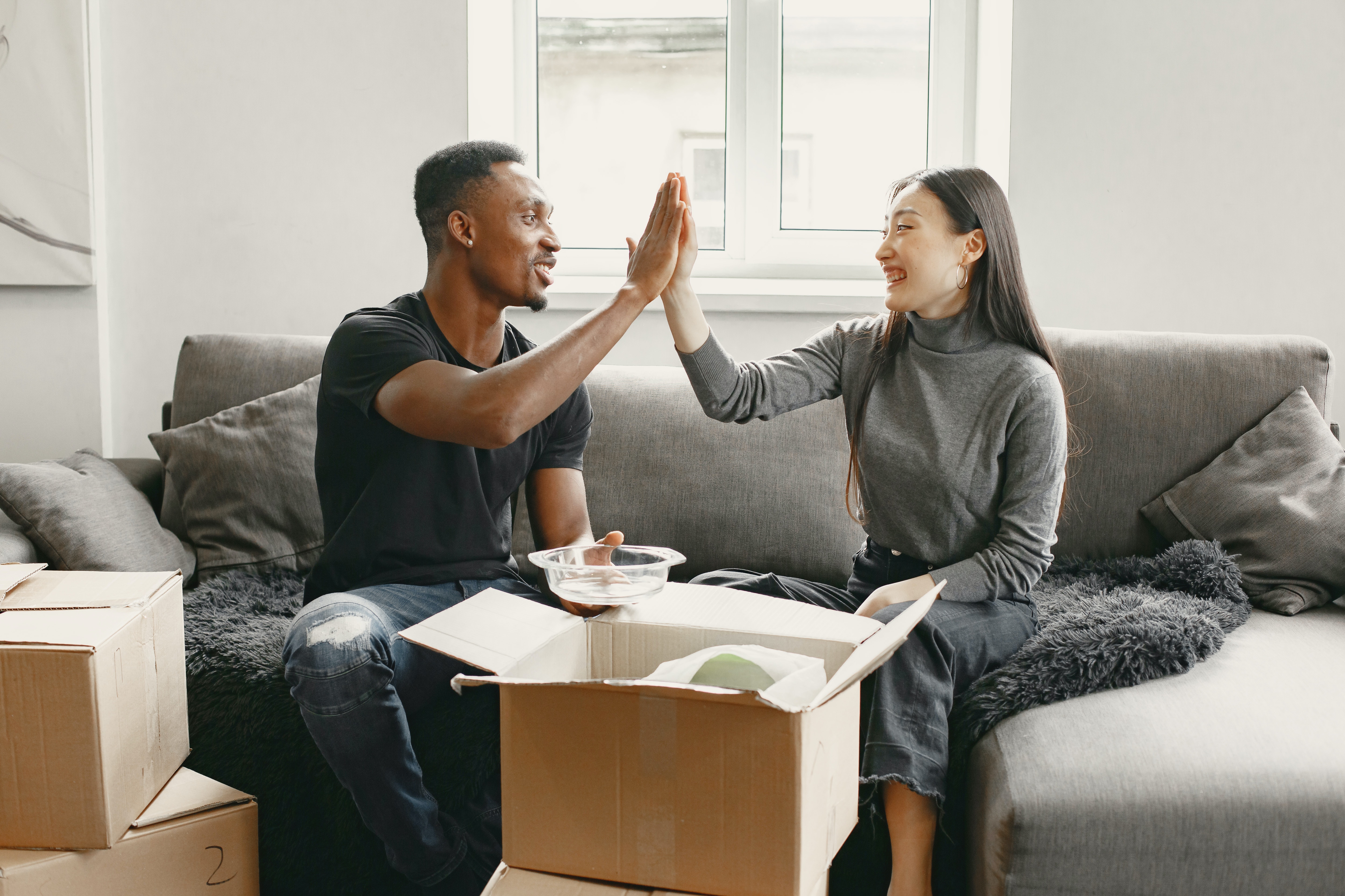 moving, couple moving, high five, moving boxes
Photo by Gustavo Fring: https://www.pexels.com/photo/man-and-woman-sitting-on-couch-unpacking-boxes-7489125/
