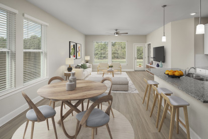 Dining, kitchen, and living space in Maple homes at Camden Woodmill Creek in The Woodlands, TX