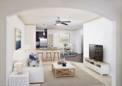 Beautiful open floor plan of living room, looking into the kitchen.