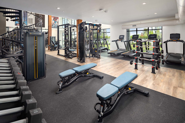Free weights and machines in the 24-hour fitness center at Camden West Nashville apartments in Nashville, TN