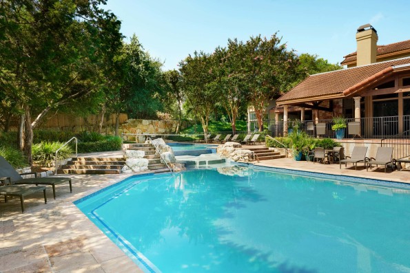 Pool with water feature and sundeck