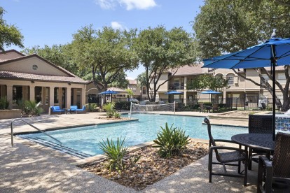 Resort-style pool with deck seating at Camden Cimarron apartments in Irving, TX