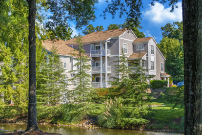 Garden-style community surrounded by lush greenery at Camden Sedgebrook in Huntersville, NC
