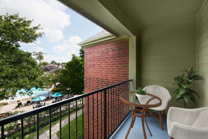 Balcony overlooking the resort-style pool at Camden Holly Springs Apartments in Houston, TX