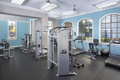 24-hour fitness center with strength training equipment