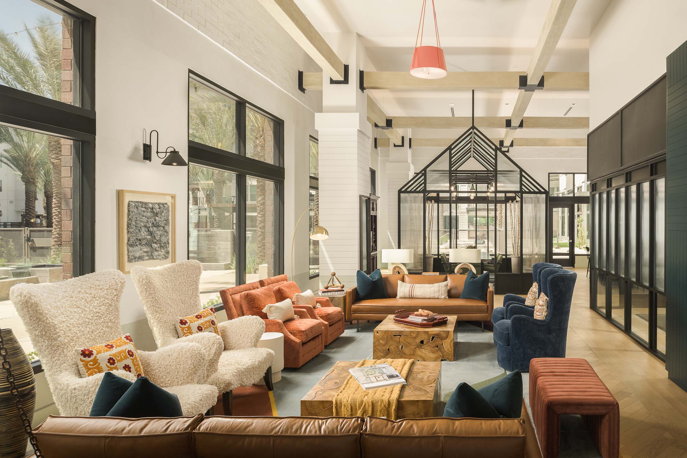 Resident lounge with greenhouse workspace seating at Camden Gilbert apartment homes in Gilbert, AZ