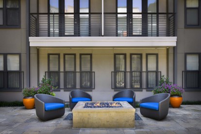 Poolside firepit and seating at Camden Belmont apartments in Dallas, TX