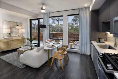 Modern gray apartment with hardwood-style flooring and expansive windows