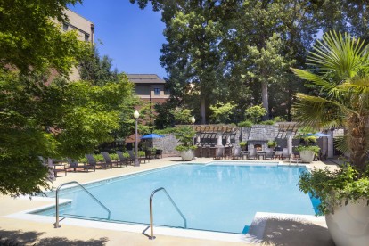 Pool at the terraces with expansive sundeck and outdoor dining areas