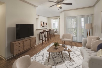 Open concept living room with direct access to patio at Camden Midtown Apartments in Houston, TX