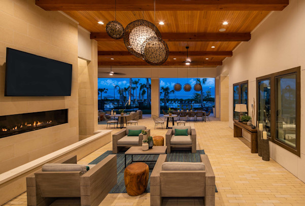 Camden Clearwater apartments outdoor resident lounge seating area and fireplace