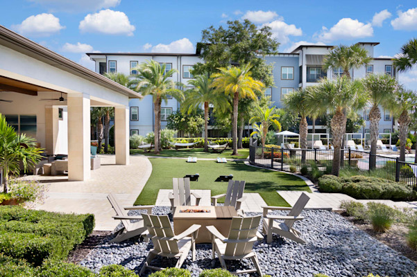Camden Clearwater apartments in clearwater, fl outdoor resident lounge with firepit and hammock lounge