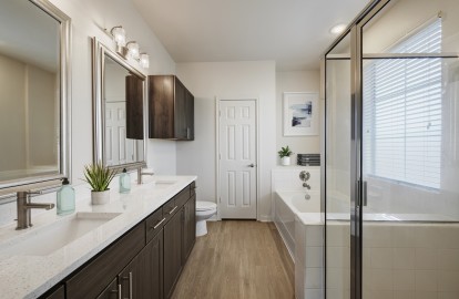 Townhome bathroom with two sinks, walk-in shower and bathtub at Camden Cedar Hills