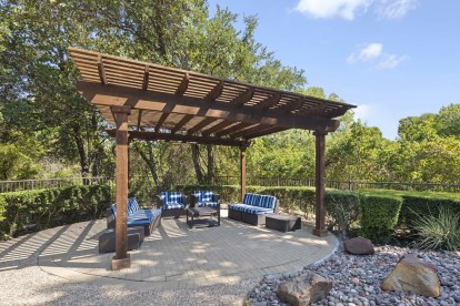 Poolside covered seating area at Camden Legacy Creek apartments in Plano, TX