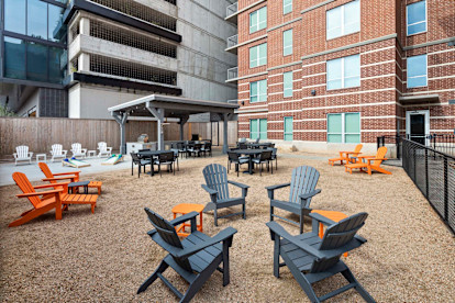 Backyard resident lounge with grills at Camden Rainey Street apartments in Austin, TX