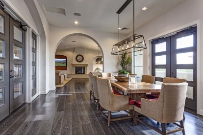 Resident clubhouse dining area with light fixture and wood style flooring