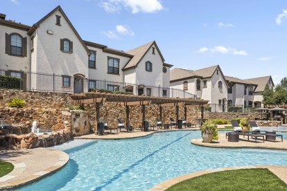 Resort-style pool with waterfall feature at Camden Brushy Creek apartments in Austin, TX