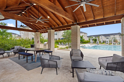 Poolside pavilion lounge with seating at Camden Leander apartments in Leander, Tx