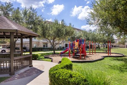 Private playground and seating area at Camden Downs at Cinco Ranch in Katy, TX. 