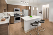 Camden Foothills Apartments Scottsdale AZ open concept kitchen with stainless steel appliances and island