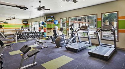 Fitness center with cardio machines and free weights