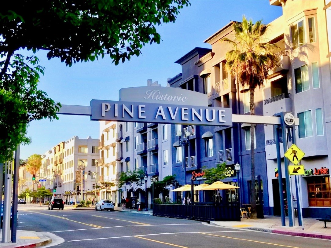 The Pine Ave. sign that stretches across Pine Ave. between 4th and 5th streets. 