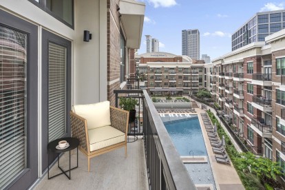 Private balcony overlooking the pool with views of the American Airlines Center