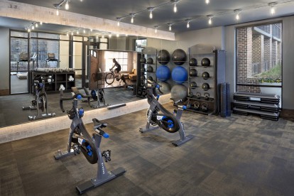 Fitness studio with spin bikes and virtual trainer