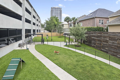 Large landscaped onsite private dog park