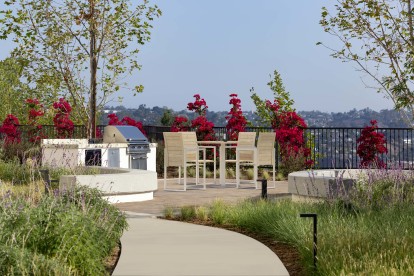 Exclusive barbecue grilling station with sink and dining areas